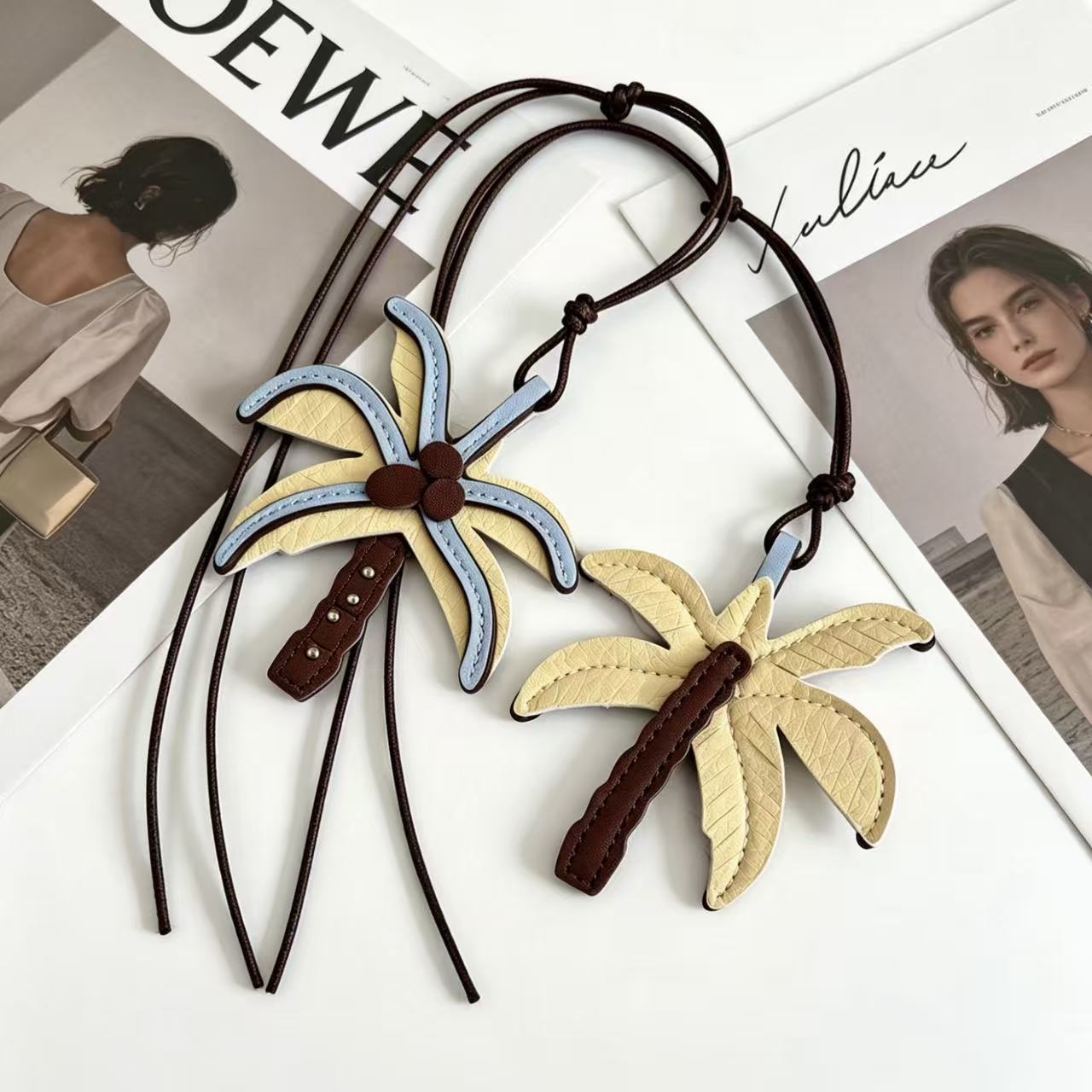 Close view of a blue yellow and brown layered palm tree bag charm