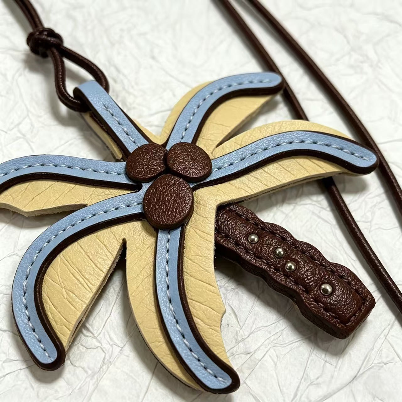 Layered coconut palm tree bag charm with stitched leaves and brown trunk