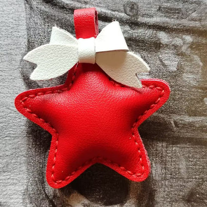 Red leather star ornament with white bow, handmade for DIY charm or keychain accessory