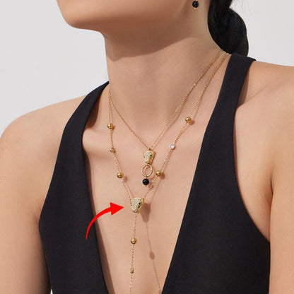 model wearing stainless steel leopard head zircon layered necklace