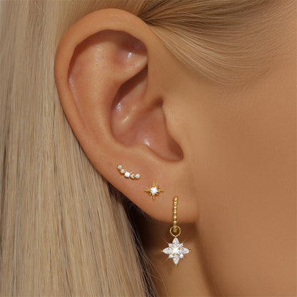 High resolution product shot of marquise diamond style gold hoops and pave stud earring set on neutral background.