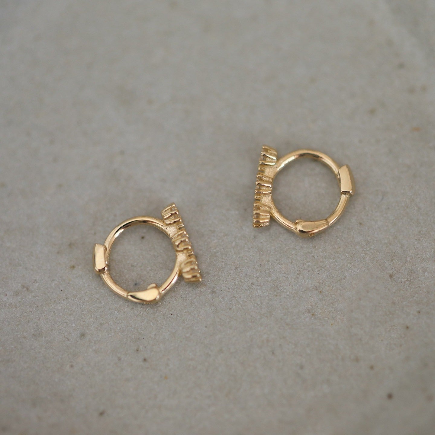 S925 sterling silver mini cartilage hoop earrings with three cubic zirconia stones and 14K gold plating