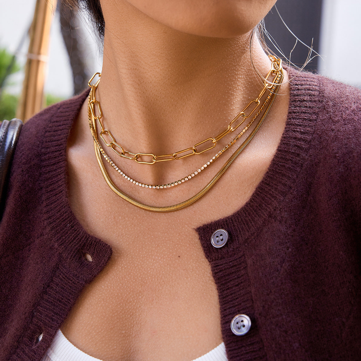 Stainless steel minimalist multi layer necklace worn on neckline