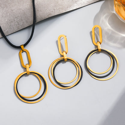 Matching stainless steel necklace and earring set in black and gold tone for gift shops and resale