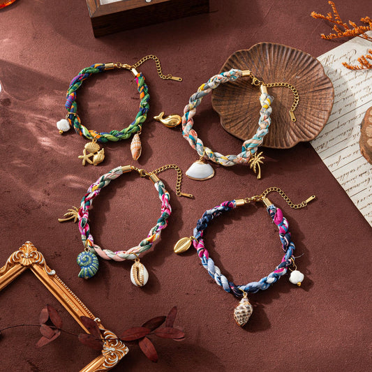 Ocean themed braided bracelet set with sea shell charms and coastal pendants wholesale
