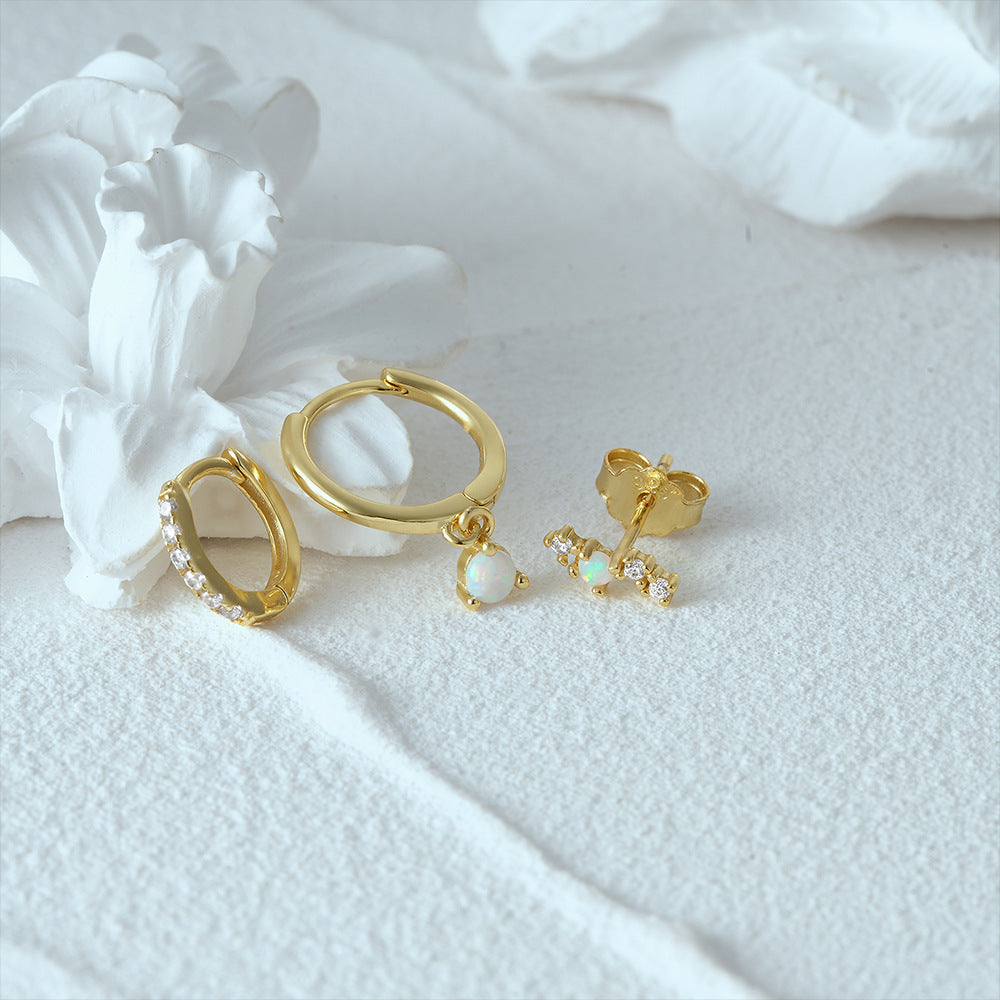 S925 sterling silver jewelry set featuring gold plated opal dangling hoop and pavé crystal earrings by JR Fashion Accessories.