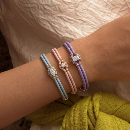 Pastel braided bracelets; gold metal bracelet not included
