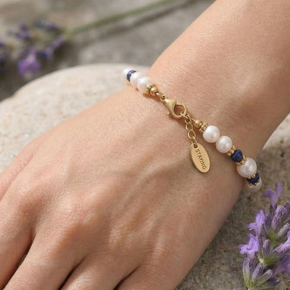 Pearl beaded bracelet on wrist blue stone accents adjustable extender