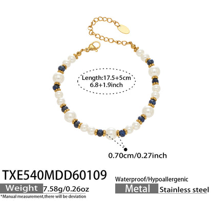 Pearl and blue beaded bracelet on wrist gold tone spacer details