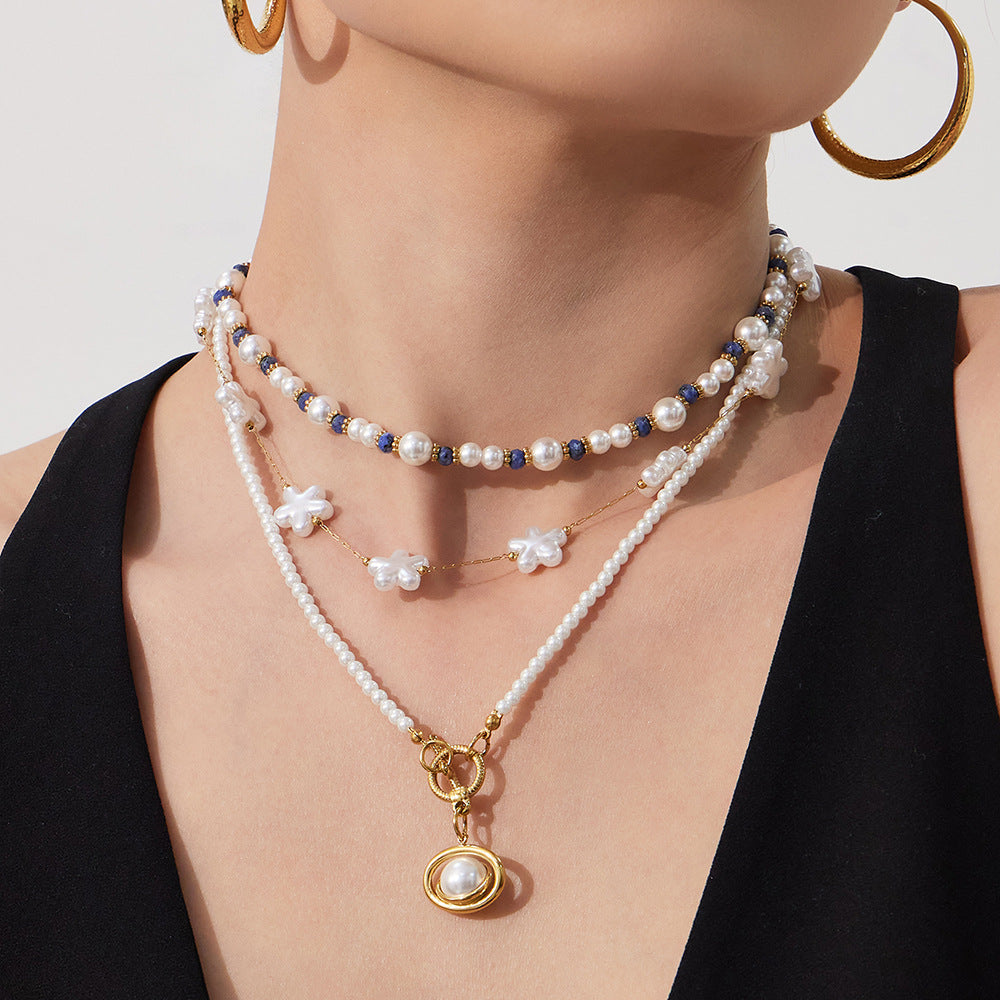 model wearing pearl pendant beaded necklace stainless steel