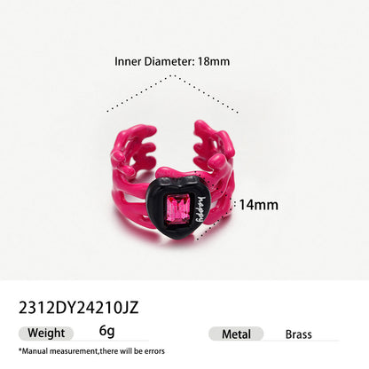 Pink chain link enamel ring with black heart and pink crystal accent.