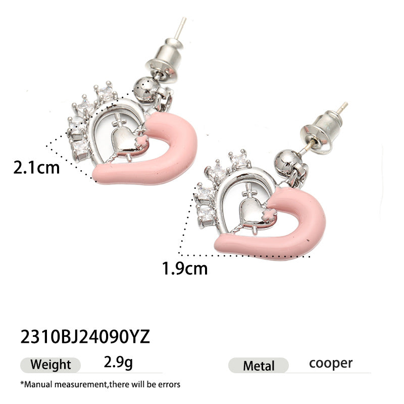 Pink enamel heart earrings with crystal details and size measurements