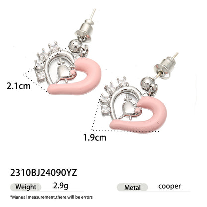 Pink enamel heart earrings with crystal details and size measurements