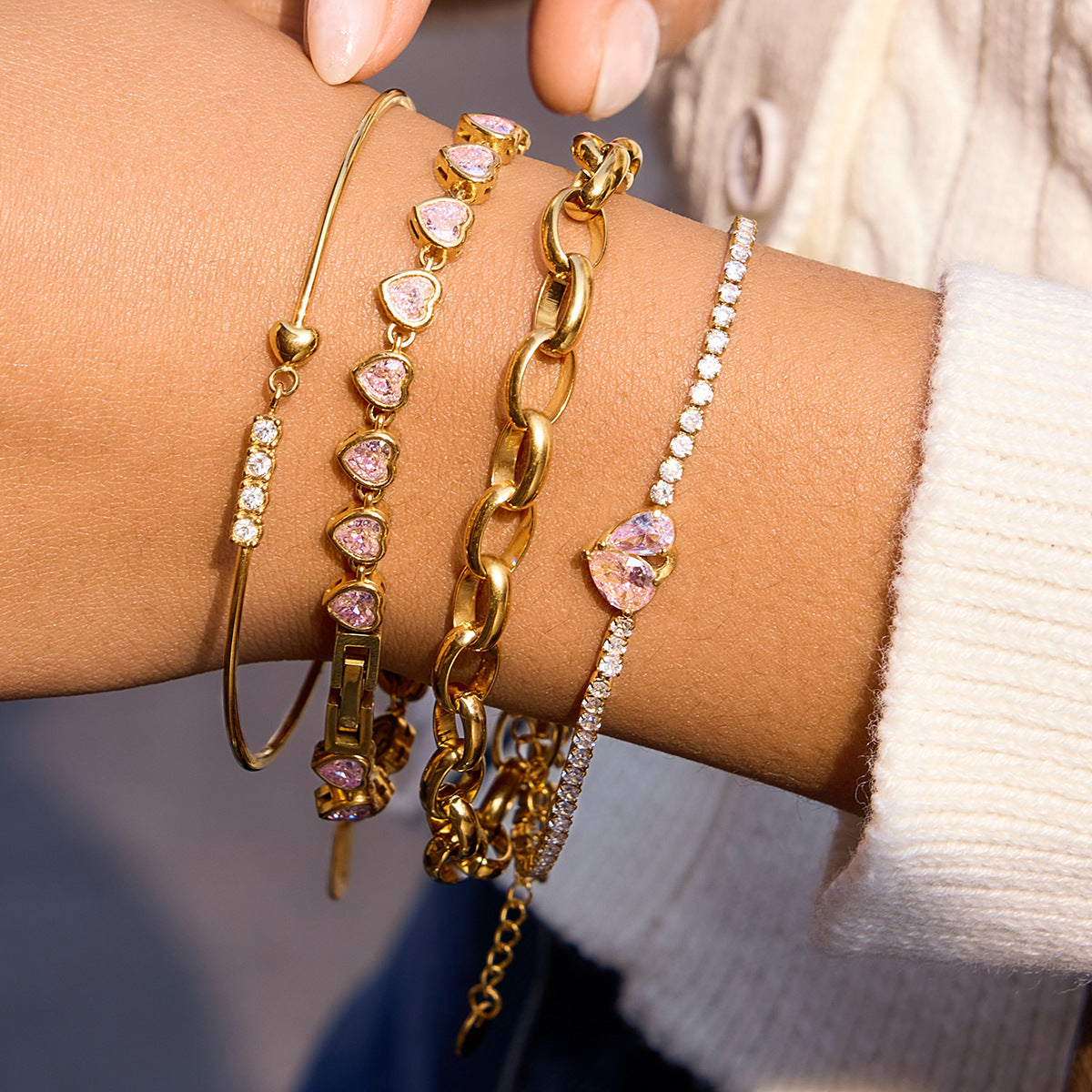 Close up of pink heart zircon tennis bracelet on wrist