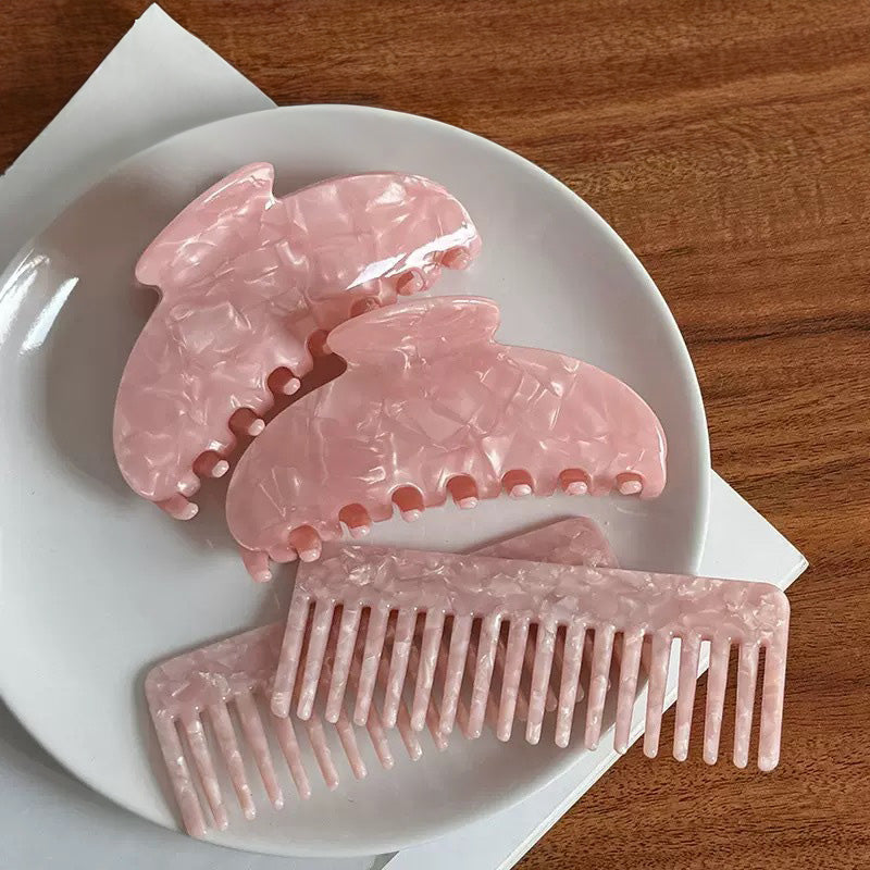 Pink claw hair clip and matching acetate hair comb set with marble texture for women
