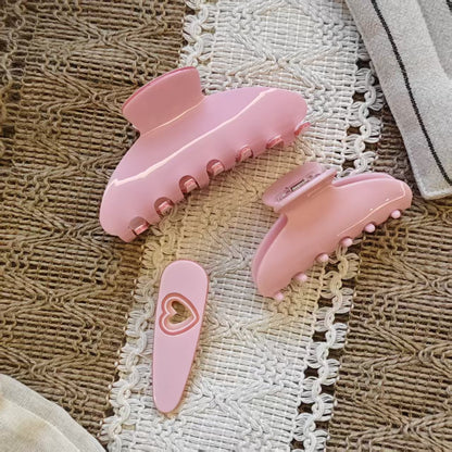 3 Pcs pink claw hair clip set featuring one large shark clip, one small claw, and a heart shaped hair clip.