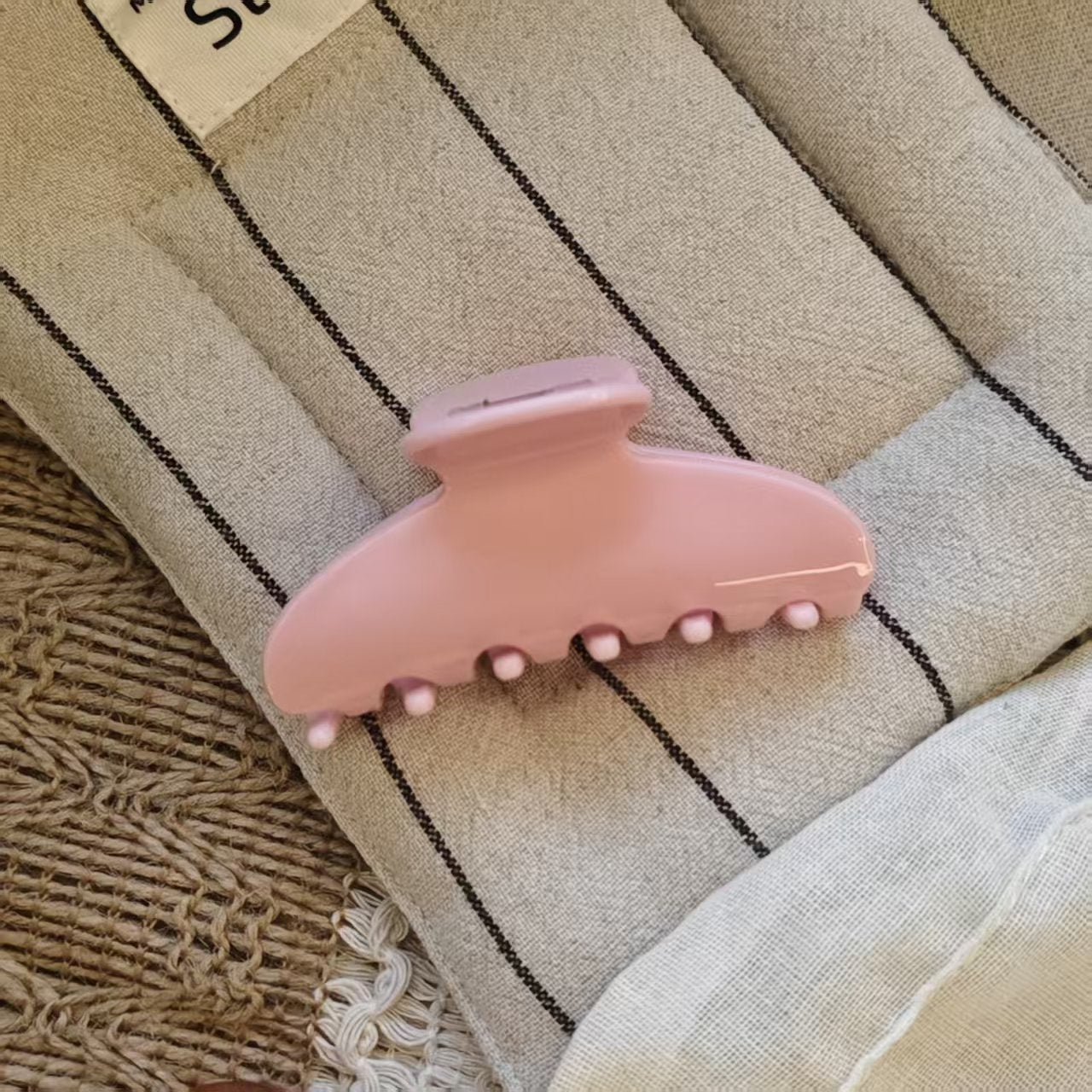 Small pink claw hair clip for half-up hairstyles and cute pink hair clips aesthetic.