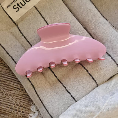 Large pink claw hair clip made of luxury acetate for thick hair strong hold.