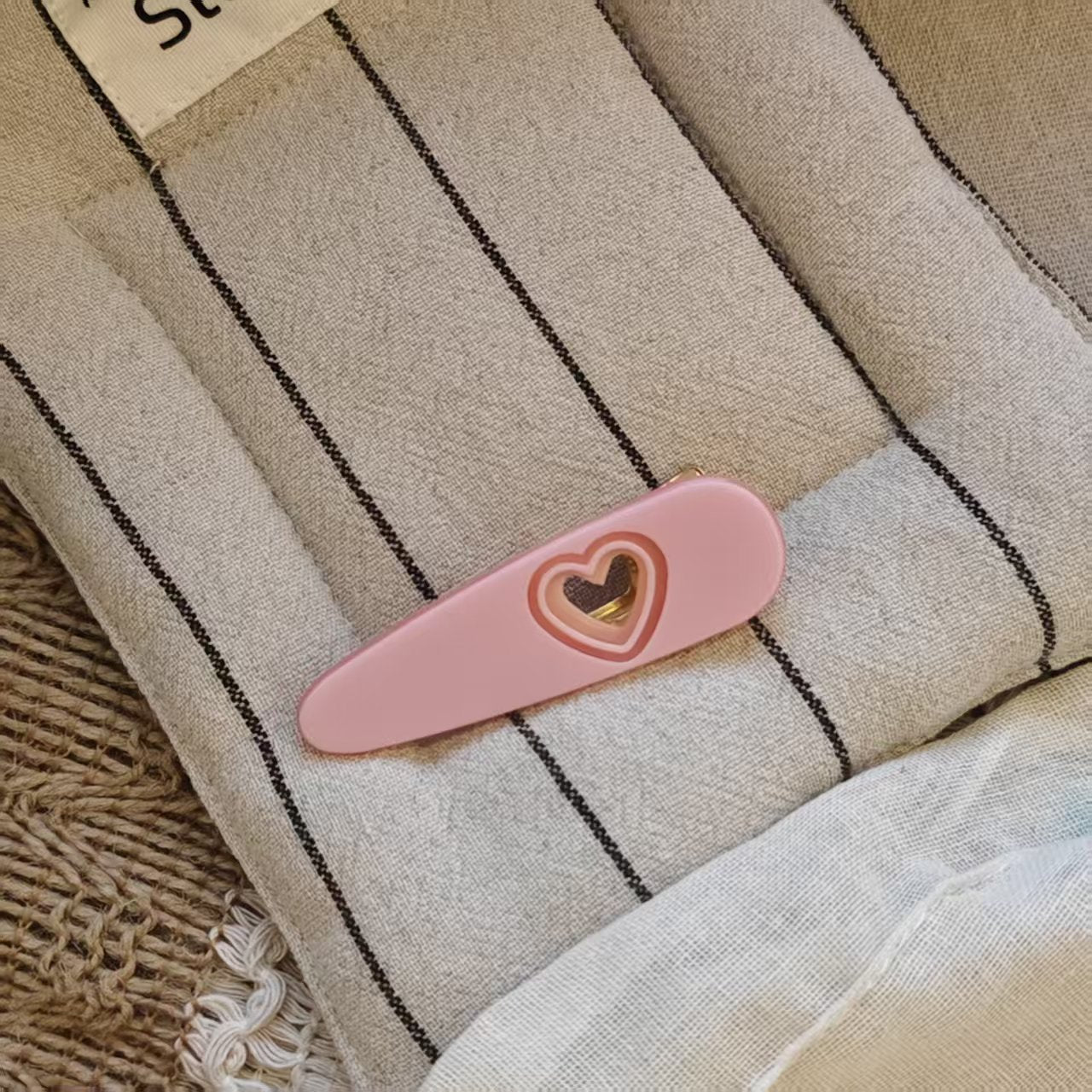 Alt Text: Cute pink hair clips heart shaped hair barrette with gold accent for Korean style.