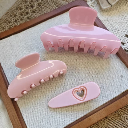 3 Pcs pink claw hair clip set featuring one large shark clip, one small claw, and a heart shaped hair clip.