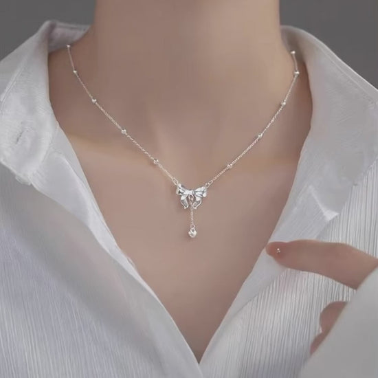 Model-wearing-S925-Silver-Bow-Necklace-JR-Fashion-Accessorie