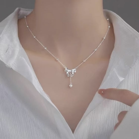 Model-wearing-S925-Silver-Bow-Necklace-JR-Fashion-Accessorie