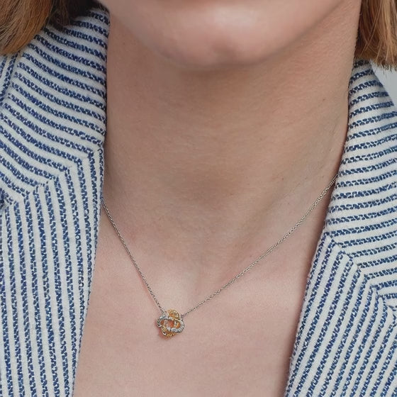 minimalist knot bar pendant necklace showing two tone geometric jewelry design