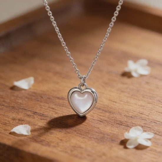 Video showcasing the light reflection and shimmering effect of the cat's eye heart necklace in S925 silver.