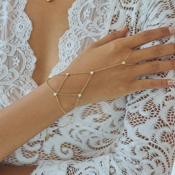 Stainless steel zircon finger bracelet worn on hand showing chain movement