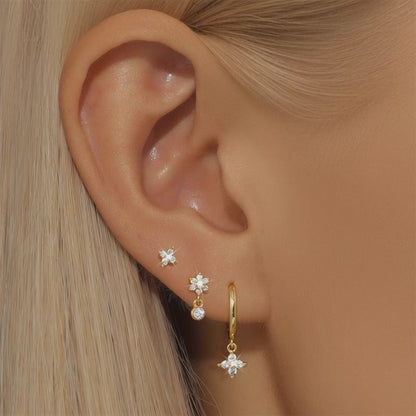 Video demonstration of the sparkling light reflection on gold star engraved hoops and flower stud earrings by JR Fashion Accessories.