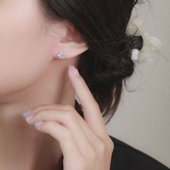 Video demonstration of the sparkling crystal and pink enamel finish on S999 silver heart earrings