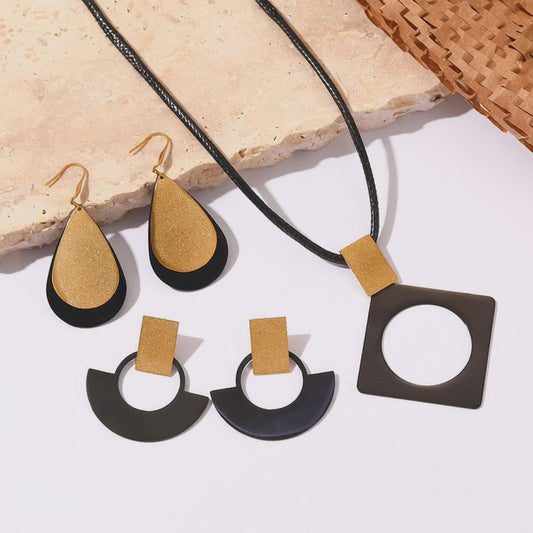 Video showing wholesale black gold stainless steel necklace and earring set for gift shops in five sets