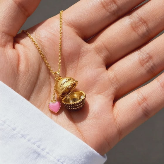 chocolate box opening pendant necklace video showing pearl inside and heart charm detail