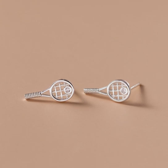 Rotating display of S925 sterling silver tennis racket stud earrings with crystal accent for wholesale jewelry buyers