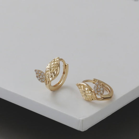 Rotating display of S925 sterling silver 18K gold plated leaf huggie earrings with cubic zirconia accents for wholesale jewelry buyers and boutique collections