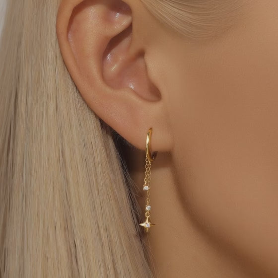 Video showing the sparkle of starburst drop earrings on a model by JR Fashion Accessories.