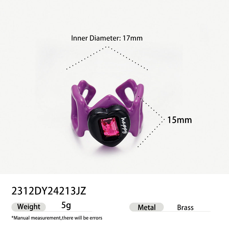 Purple geometric hollow brass ring with black heart and pink gemstone.