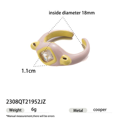 Pastel purple and yellow enamel ring with a large square crystal gemstone