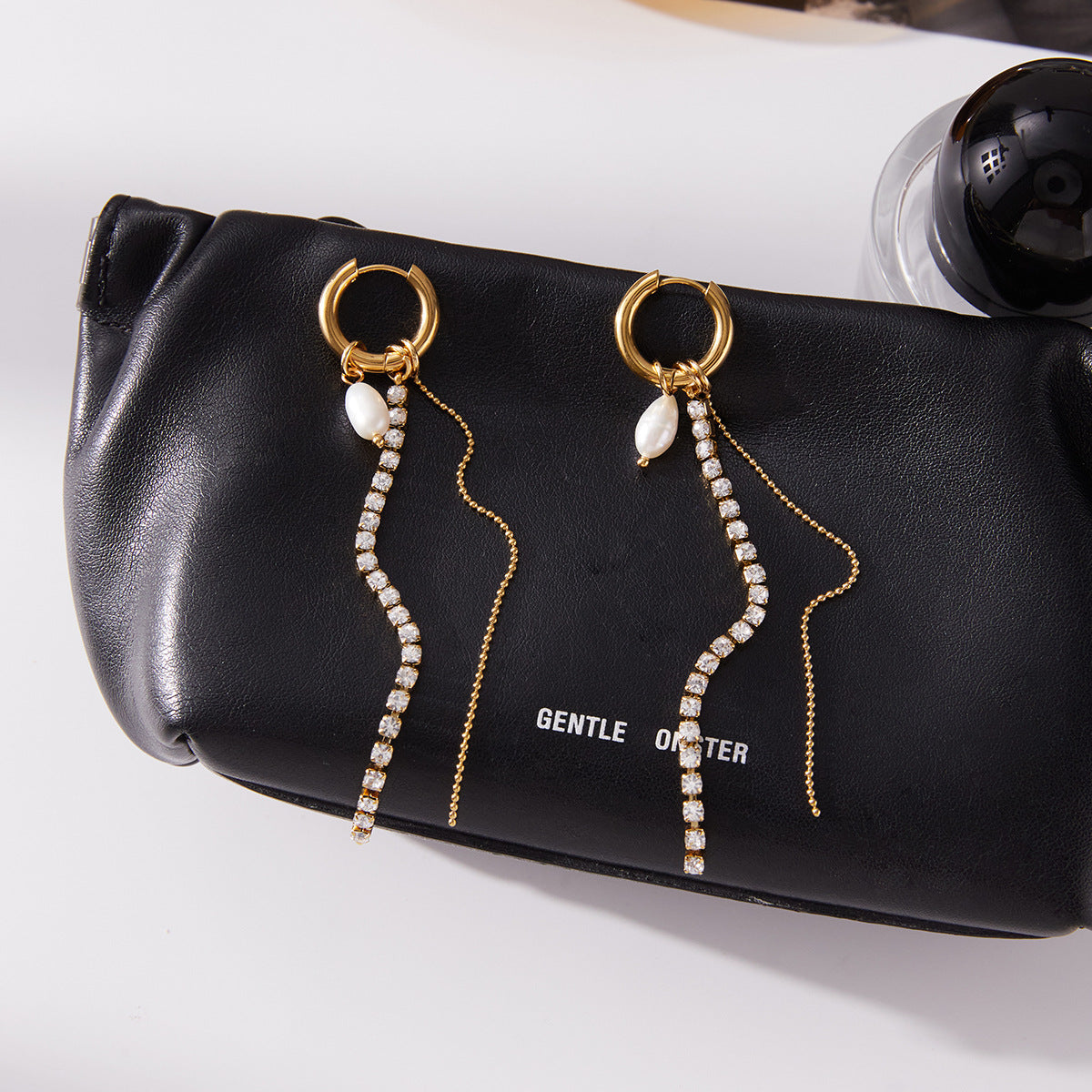 18K gold stainless steel rhinestone pearl tassel earrings on black pouch