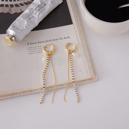 Elegant gold stainless steel rhinestone pearl tassel earrings close up