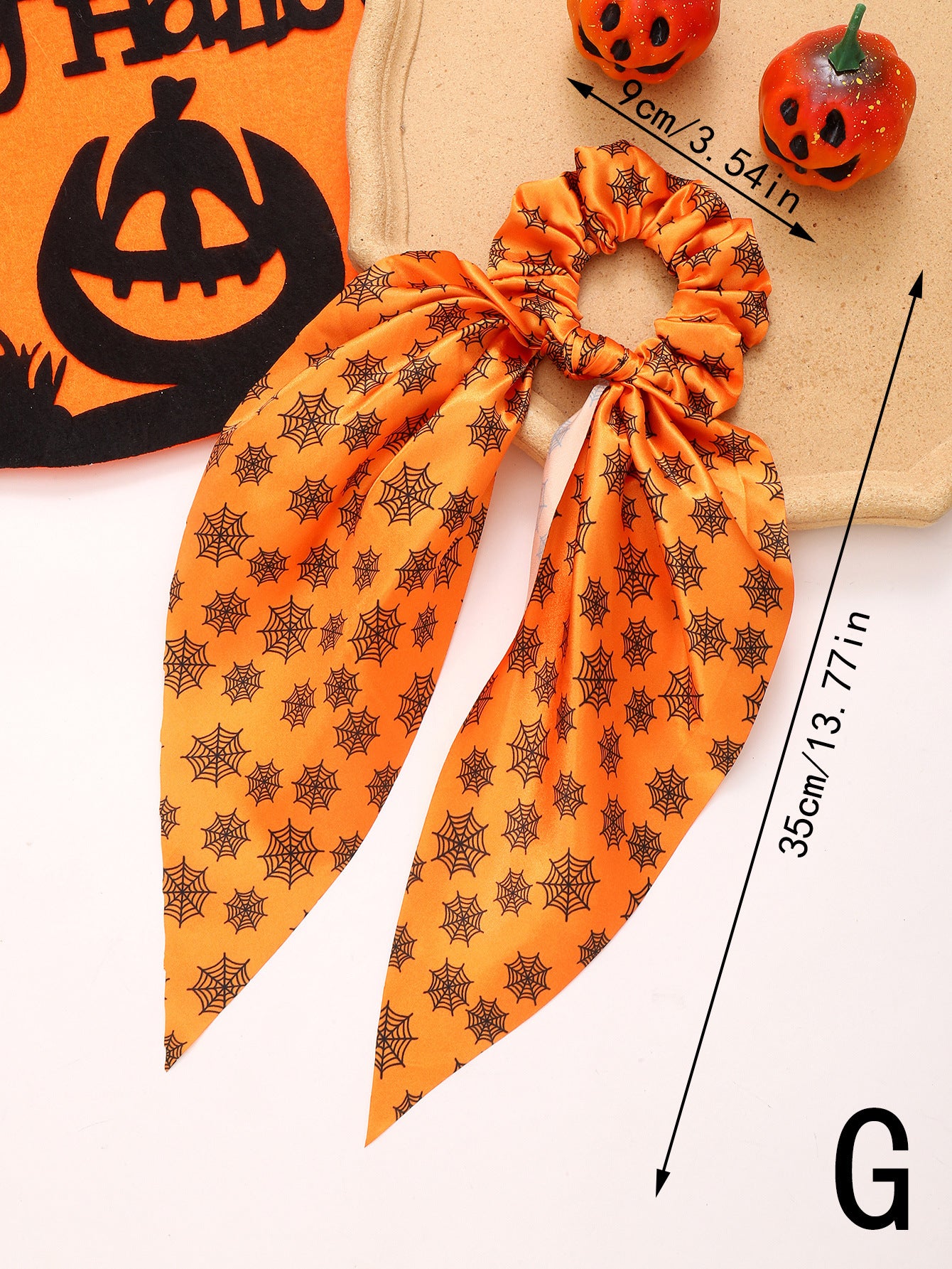 orange hair scrunchy with ribbon