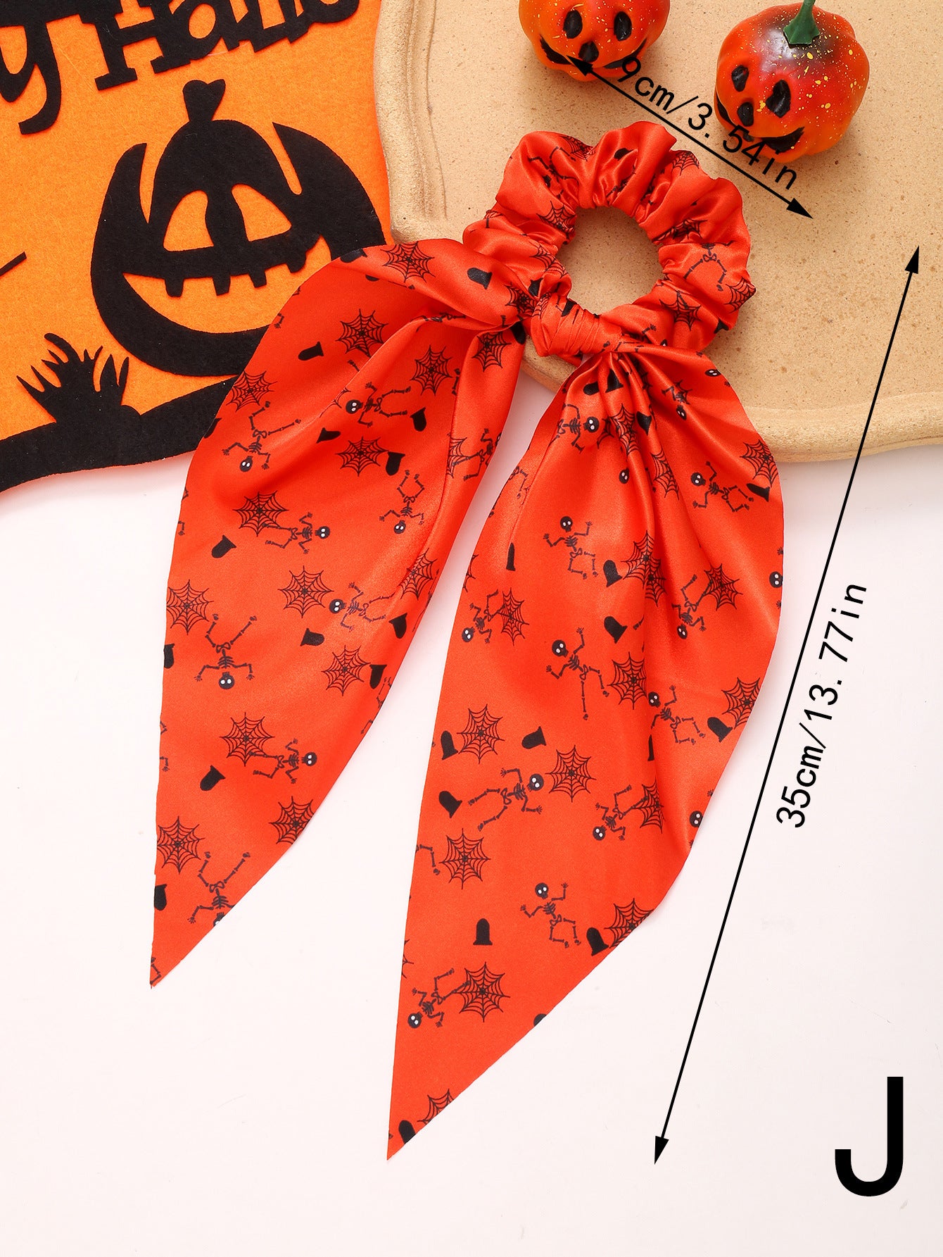 orange hair scrunchy with ribbon