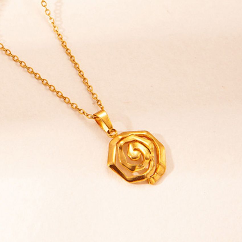 close up stainless steel rose flower pendant necklace with polished gold finish