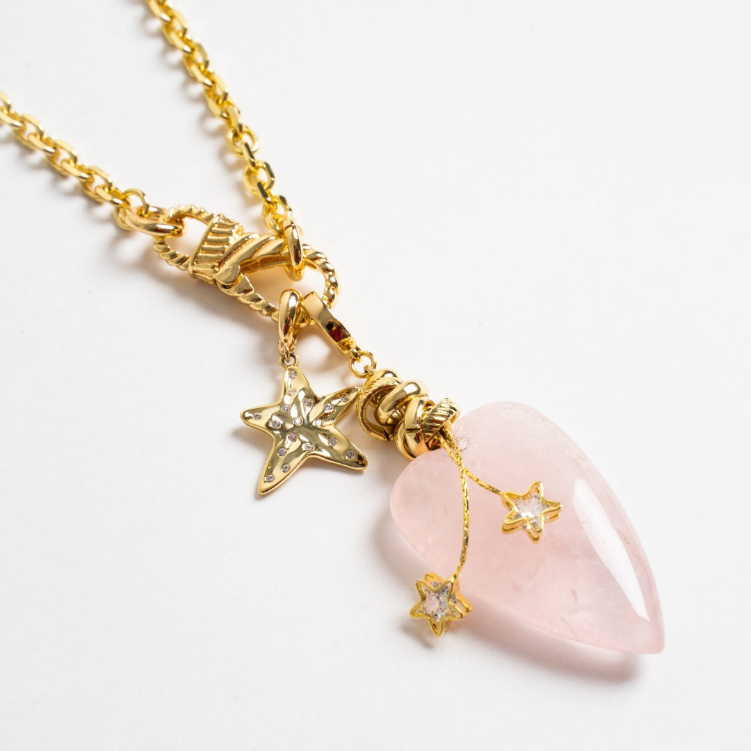rose quartz heart pendant necklace with gold chain and star charm details