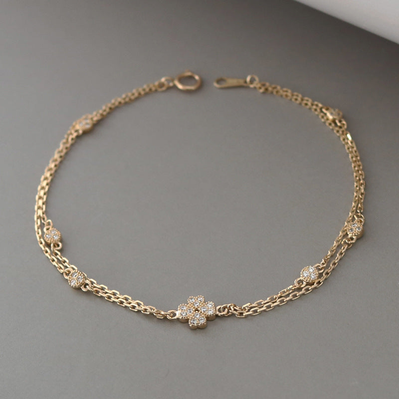 S925 sterling silver double chain bracelet with gold plating and cubic zirconia flower stations