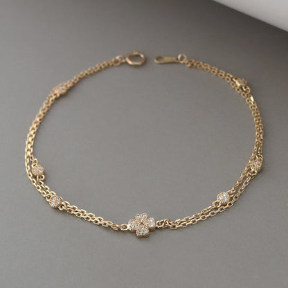S925 sterling silver double chain bracelet with gold plating and cubic zirconia flower stations