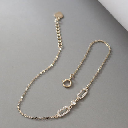 Front view of gold plated S925 oval cubic zirconia chain bracelet with extension clasp