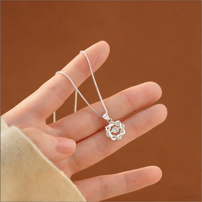 Close up of S999 silver eight point star pendant necklace with moving zircon centerpiece