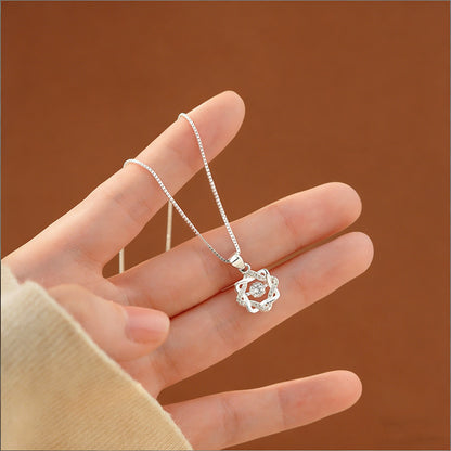 Close up of S999 silver eight point star pendant necklace with moving zircon centerpiece