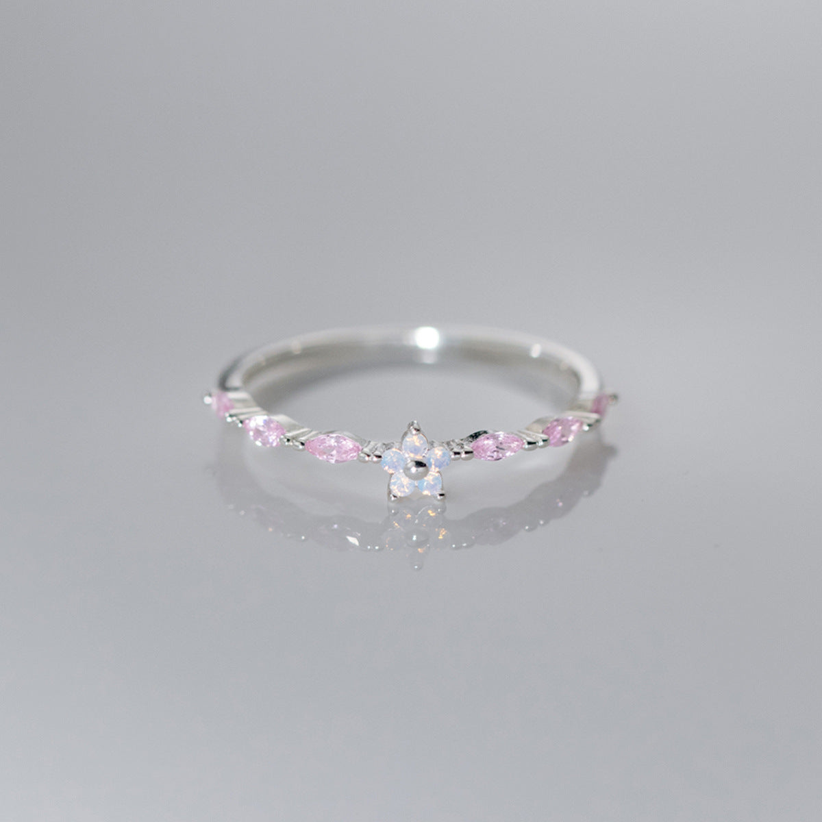 Sterling silver cherry blossom ring featuring pink marquise zircon accents and floral centerpiece